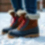 Stylish winter boots on a snowy surface